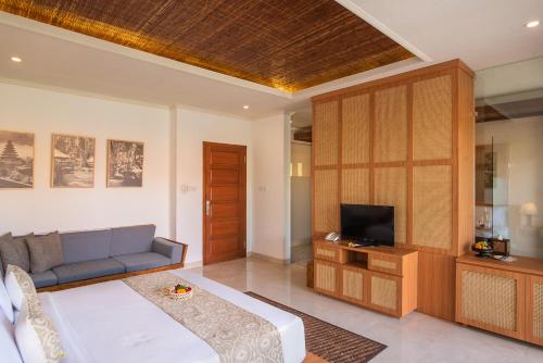 TV a/nebo společenská místnost v ubytování Budhi Ayu Villas and Cottages Ubud by Mahaputra-CHSE Certified