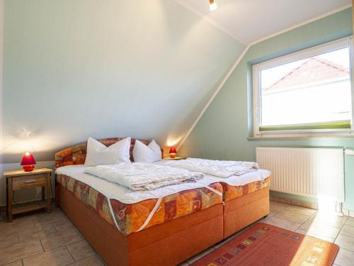 Ένα ή περισσότερα κρεβάτια σε δωμάτιο στο Ferienhaus Karola, Wohnung 2 - OG