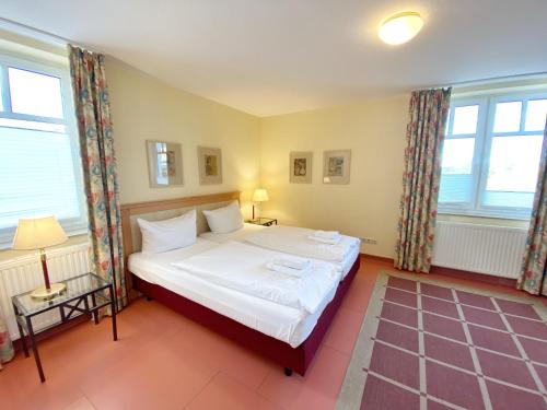 Postel nebo postele na pokoji v ubytování Appartements am Rondell Neddesitz, Appartement 306