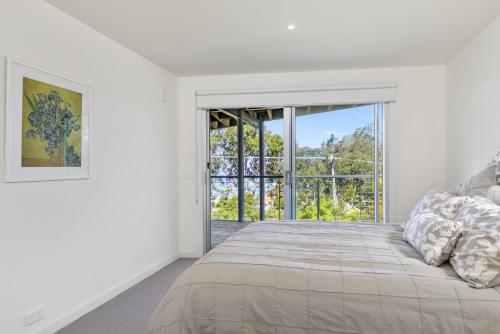 Ένα ή περισσότερα κρεβάτια σε δωμάτιο στο Sunhaven