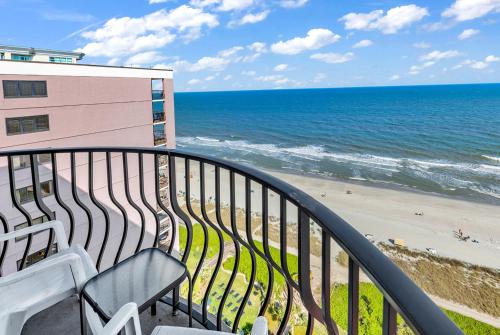 a balcony with a view of the beach at Oceanfront Penthouse, Two-Story, 3 Bedrooms in Myrtle Beach