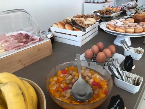 a table topped with lots of different types of food at HOTEL FLYING in Pesaro
