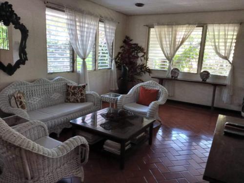 a living room with two couches and a coffee table at Casa Joaquin BnB in Manila