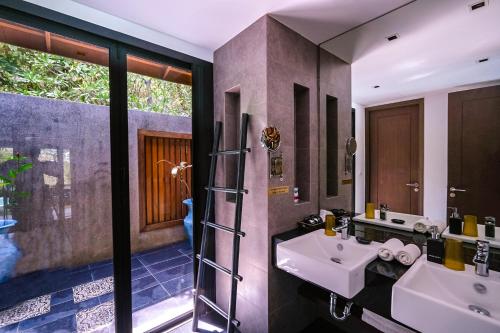 Ένα μπάνιο στο VILLA Chacha VILLA Coco VILLA Salsa RESORT APOLLONIA