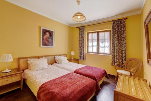 Postel nebo postele na pokoji v ubytování Cottage Sete Mares
