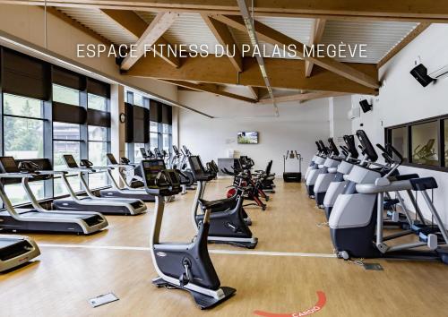 a gym with a lot of treadmills and ellipticals at Novotel Megève Mont-Blanc in Megève