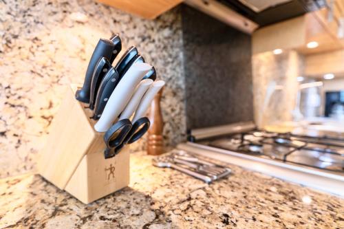 a knife block filled with knives on a kitchen counter at El Dorado Ajijic by Restavio in Ajijic