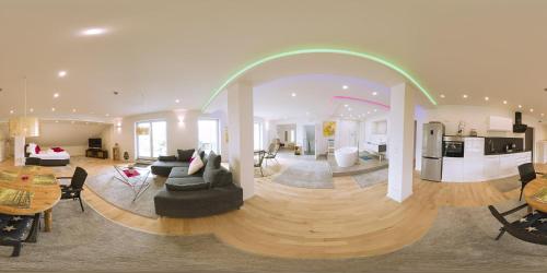 a living room with an archway in the middle of a room at Loft "Island" in Leutkirch im Allgäu