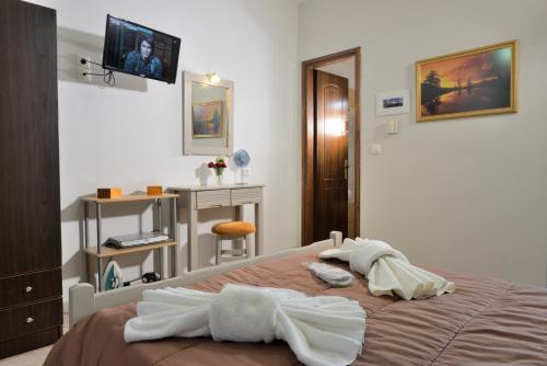 Postel nebo postele na pokoji v ubytování Artemis Apartments