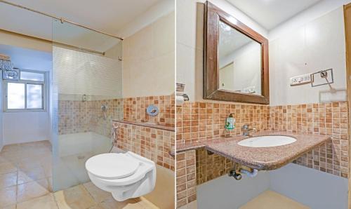 a bathroom with a toilet and a sink and a shower at Treebo White Inn Koramangala in Bengaluru