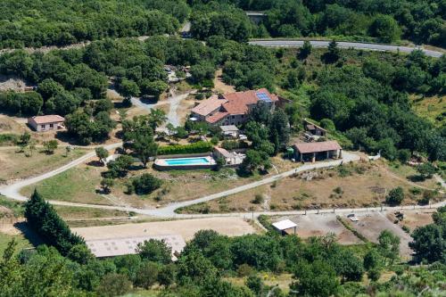an aerial view of a house with a swimming pool at Gîtes du Pont de Calmel in Rieussec