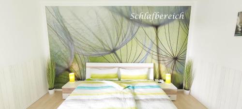 a bedroom with a bed and a wall with a drape at Ferienwohnung Pagel in Riedenburg