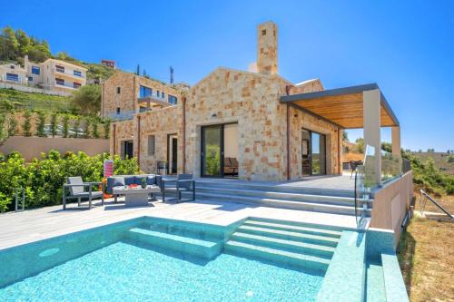 a villa with a swimming pool and a house at Narcissos Villa in Argostoli