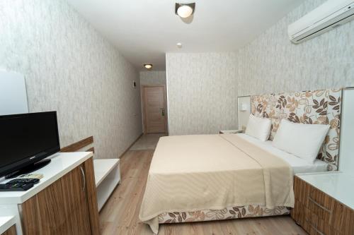Twins Hotel Çeşmeにあるベッド