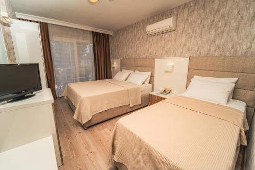 Twins Hotel Çeşmeにあるベッド