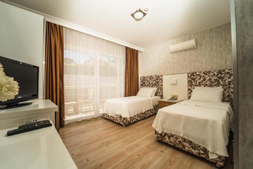 Twins Hotel Çeşmeにあるベッド