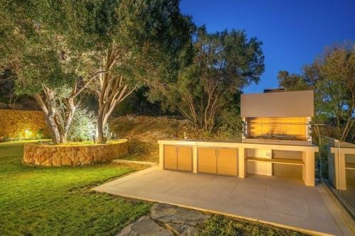 a kitchen in the backyard of a house at Echos Villa in Argostoli
