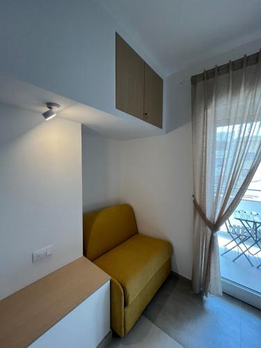 a small room with a bed and a window at B&B Casa Laforgia Soffio Mediterraneo in Polignano a Mare