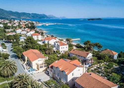 an aerial view of a town next to the ocean at Colonia Apartments in Orebić