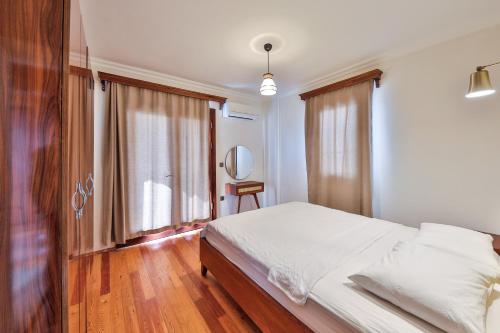 Ένα ή περισσότερα κρεβάτια σε δωμάτιο στο Nirvana Apartments