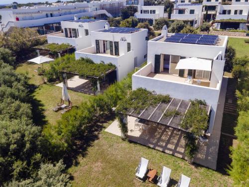 an aerial view of a house with solar panels on the roof at Biniancolla Ginesta in Biniancolla