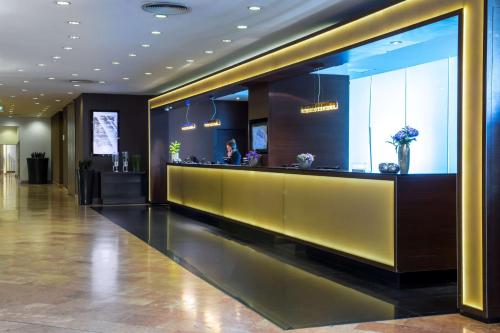 an entertainment center with a large screen tv at Radisson Blu Sobieski in Warsaw