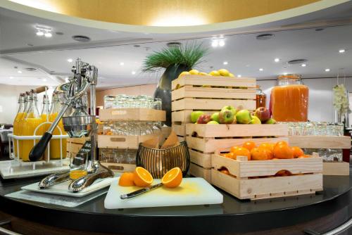 a display of fruits and vegetables on a table at Radisson Blu Sobieski in Warsaw