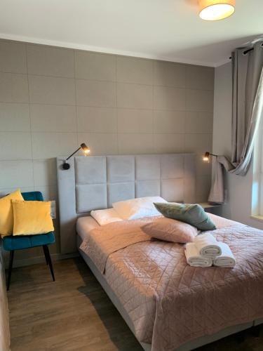 Ένα ή περισσότερα κρεβάτια σε δωμάτιο στο Sand Apartament Bel Mare Aqua - bezpłatny parking