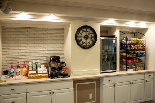 a clock on the wall above a kitchen counter at Inn on the Hudson in Peekskill