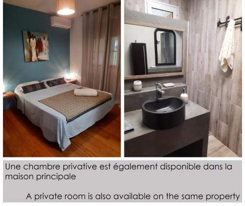 a bedroom with a bed and a sink and a mirror at CAP 8 in Le Marin