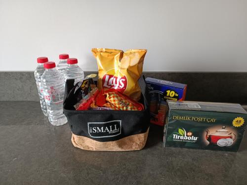 a bag of snacks and water bottles on a counter at Luxury Central Fully Equipped 3BR 2BA Apartment by Siena Suites in Istanbul