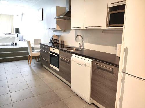 a kitchen with a sink and a counter top at Reipas in Kotka