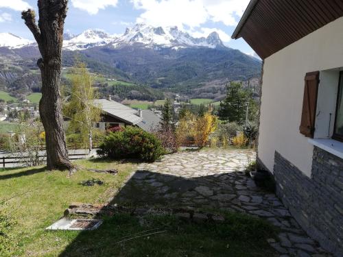 a house with a view of a mountain at 1.2.3 SOLEIL in Barcelonnette