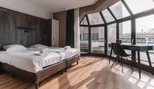 Кровать или кровати в номере Hotel Cavalli by WP Hotels