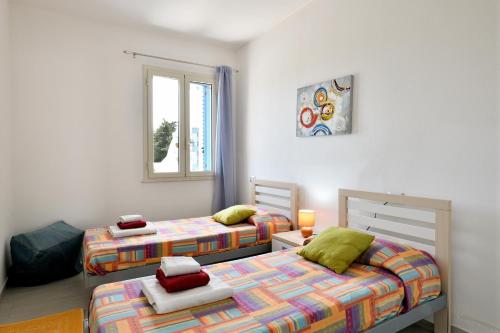 Postel nebo postele na pokoji v ubytování casa perla marina