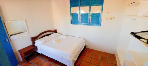 Un pat sau paturi într-o cameră la Qavi - Casa com piscina na Praia de Cotovelo