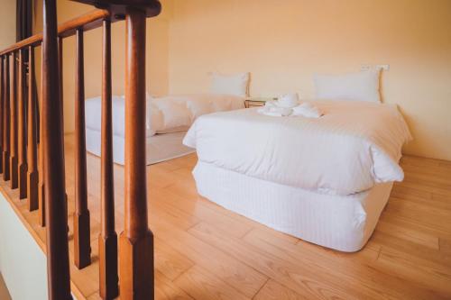 Un ou plusieurs lits dans un hébergement de l'établissement Sasa Nor Lamour B&B