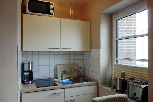 Kuchyň nebo kuchyňský kout v ubytování Elbe 1 21