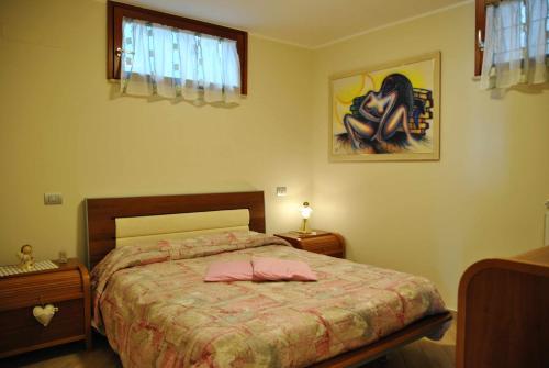 Łóżko lub łóżka w pokoju w obiekcie PICCOLO PARADISO vista mare in collina
