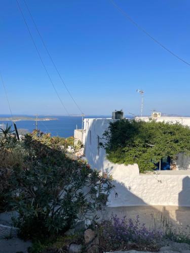 a view of a white building and the ocean at Patmos Horizon in Patmos