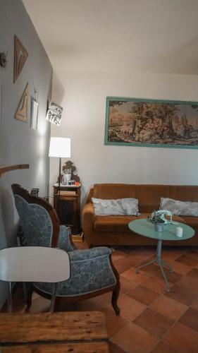 a living room with a couch and a table at B&B La Buonora in Sinio