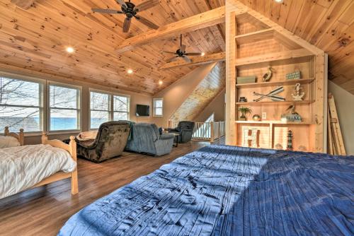 a bedroom with a large bed in a room with wooden ceilings at Lakefront Lexington Escape: Steps to Beach! in Lexington