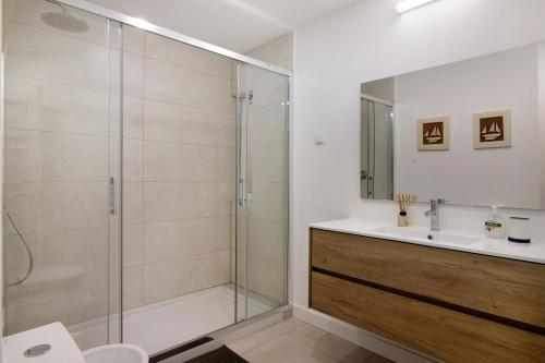 a bathroom with a shower and a sink at Encosta do Lago - With Private Pool in Quinta do Lago