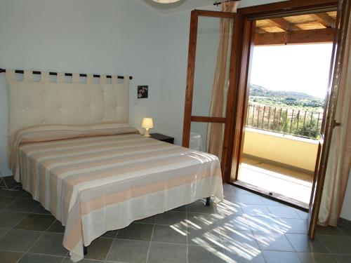 A bed or beds in a room at LE DOMUS DE CHIA_Tipo A