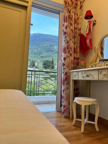 a bedroom with a bed and a window with a view at Villa sul Mare in Chalkida