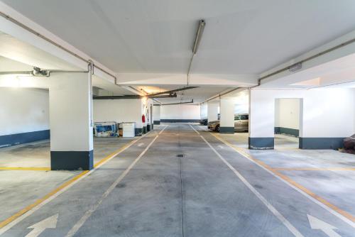 an empty parking lot in an empty parking garage at BnB Homes Ocean view Apartment with 3 spacious Terraces, 2 Swimming pools & Tennis court in Albufeira