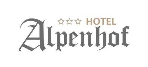 a group of five stars hotel attendant sign in black and white at Hotel Alpenhof*** in Kaltenbach