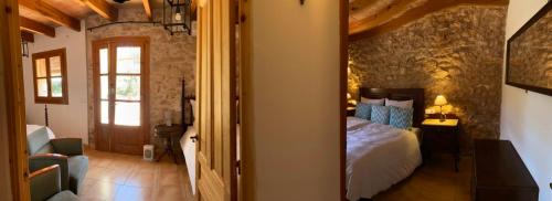 a room with a bedroom with a bed and a doorway at Finca Sa Canova Agroturismo in Campos