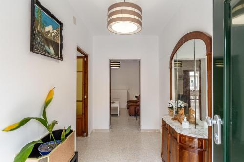 a bathroom with a mirror and a sink at Cas Llimoner in Palma de Mallorca
