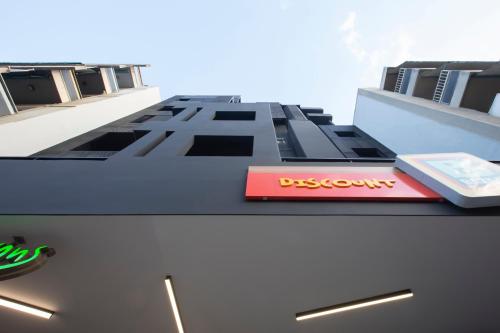 a building with a drexel sign on top of it at Thisean Modern Suites By Athens Stay in Athens